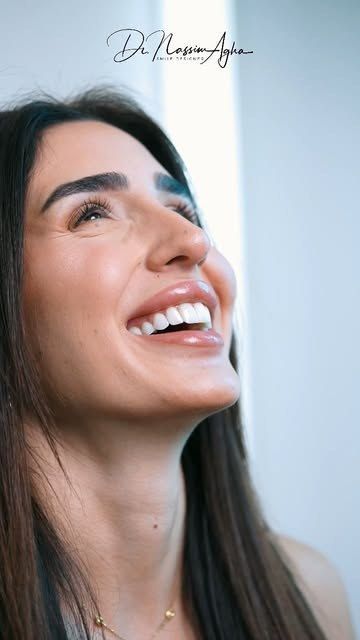 A patient smiling at the clinic after her treatment